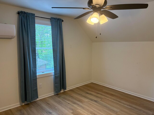 7326 State Route 19 Unit 2, Lot 321, Mount Gilead, OH 43338 - additional living space with wood finished floors, a ceiling fan, lofted ceiling, an AC wall unit, and baseboards