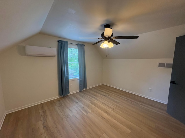 7326 State Route 19 Unit 2, Lot 321, Mount Gilead, OH 43338 - additional living space with a wall mounted AC, vaulted ceiling, wood finished floors, ceiling fan, and baseboards
