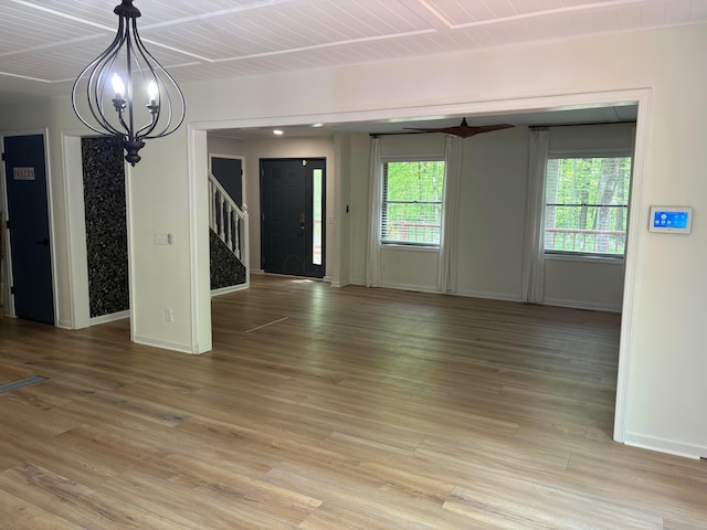 7326 State Route 19 Unit 2, Lot 321, Mount Gilead, OH 43338 - unfurnished living room featuring stairway, a chandelier, baseboards, and light wood-style floors