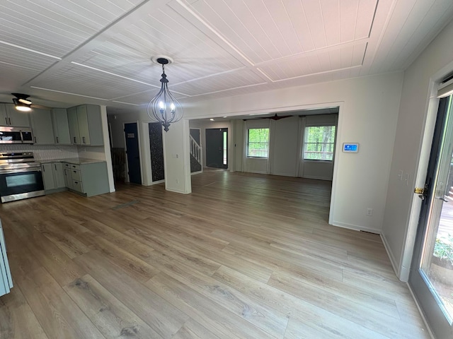 7326 State Route 19 Unit 2, Lot 321, Mount Gilead, OH 43338 - unfurnished living room featuring a ceiling fan, light wood-type flooring, stairs, wooden ceiling, and baseboards