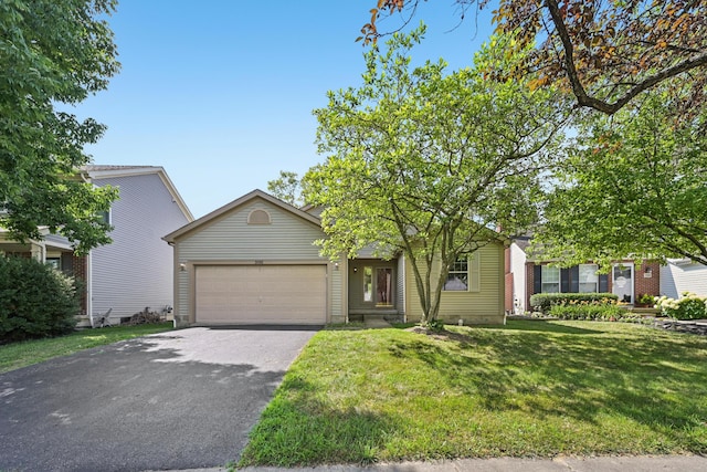 3092 Andrew James Dr, Hilliard, OH 43026 - obstructed view of property with driveway, an attached garage, and a front lawn