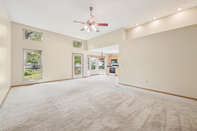 3092 Andrew James Dr, Hilliard, OH 43026 - unfurnished living room featuring light colored carpet, ceiling fan, recessed lighting, and a high ceiling