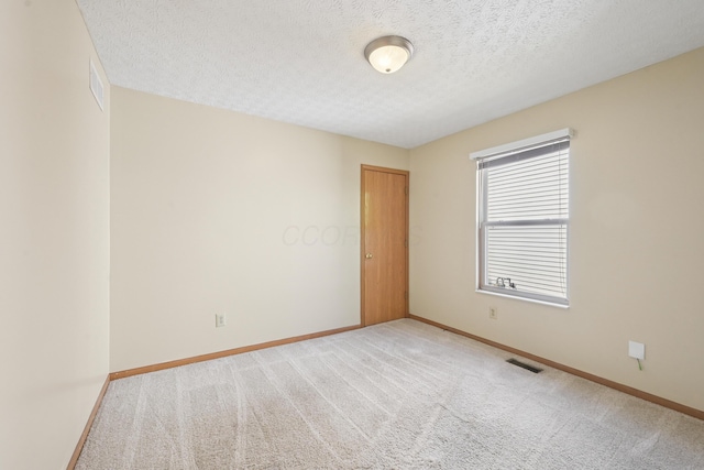 3092 Andrew James Dr, Hilliard, OH 43026 - carpeted empty room with baseboards and a textured ceiling