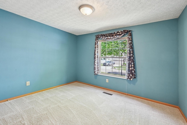 3092 Andrew James Dr, Hilliard, OH 43026 - carpeted spare room featuring baseboards and a textured ceiling