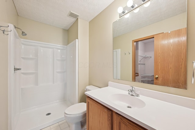 3092 Andrew James Dr, Hilliard, OH 43026 - bathroom with a shower, vanity, a textured ceiling, and tile patterned flooring