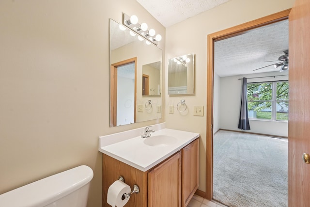 3092 Andrew James Dr, Hilliard, OH 43026 - half bathroom featuring a textured ceiling, vanity, and a ceiling fan
