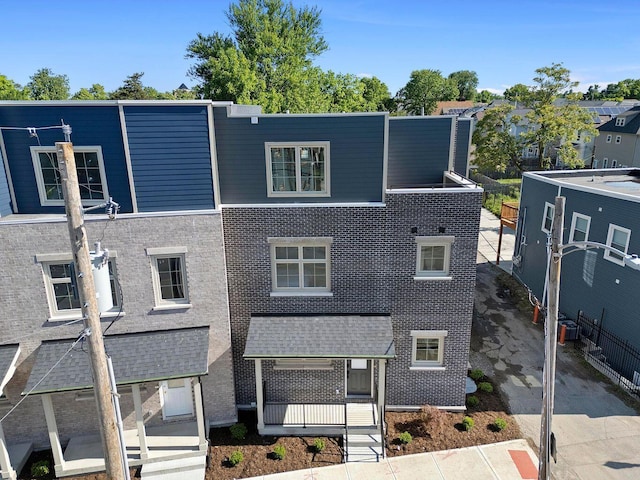view of front of house featuring brick siding