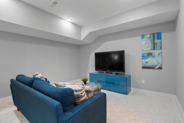 carpeted living area featuring baseboards and visible vents
