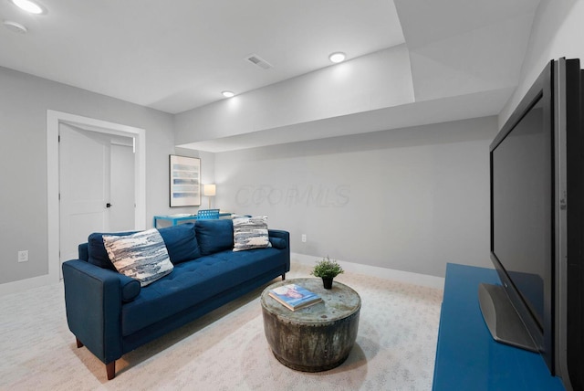 living area featuring baseboards, recessed lighting, and carpet flooring