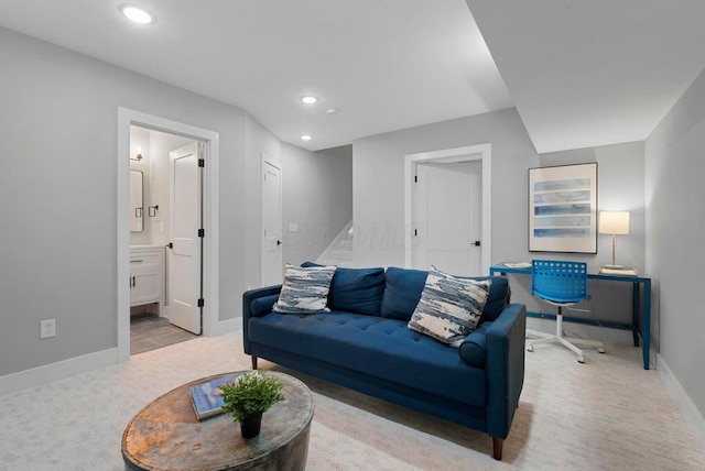 living room with light carpet, baseboards, and recessed lighting
