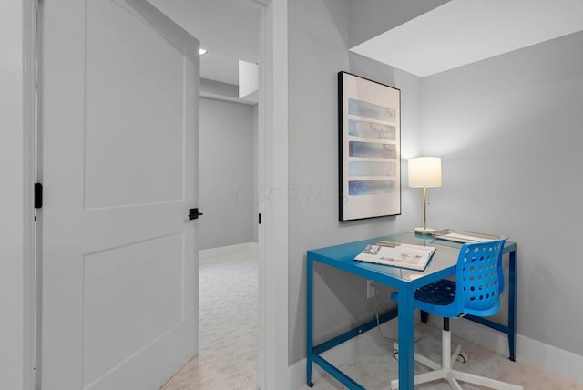 carpeted office featuring baseboards