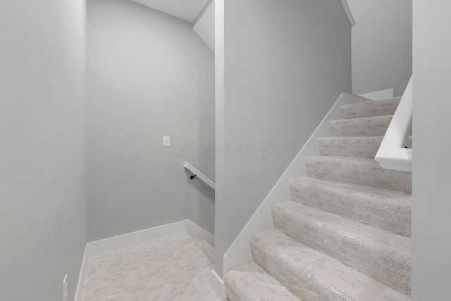 stairway with baseboards