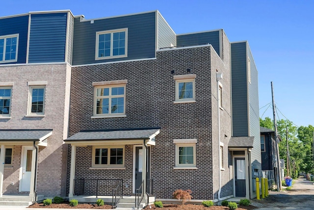 view of property with brick siding