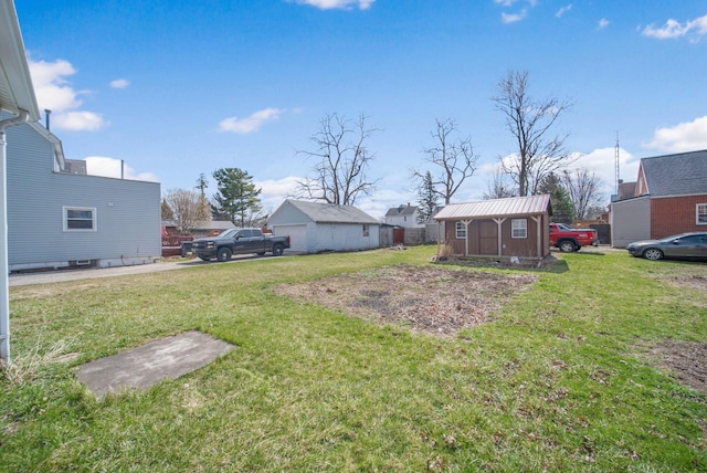 view of yard with an outdoor structure and a storage shed