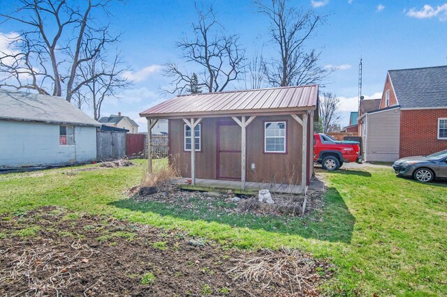 view of shed with fence