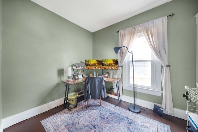 office space featuring baseboards and wood finished floors