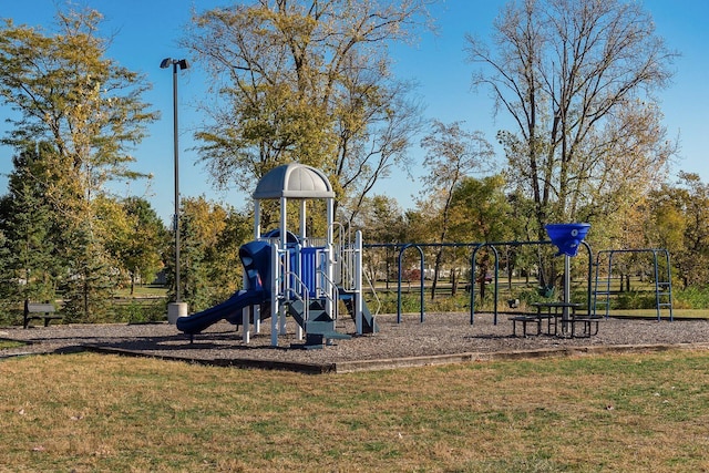 community jungle gym with a lawn