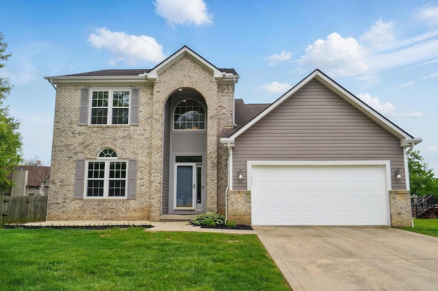 traditional-style home with brick siding, driveway, and an attached garage