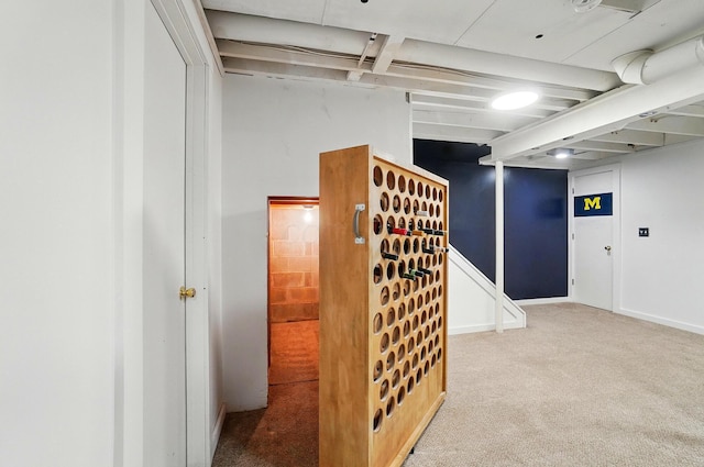 hallway with carpet floors
