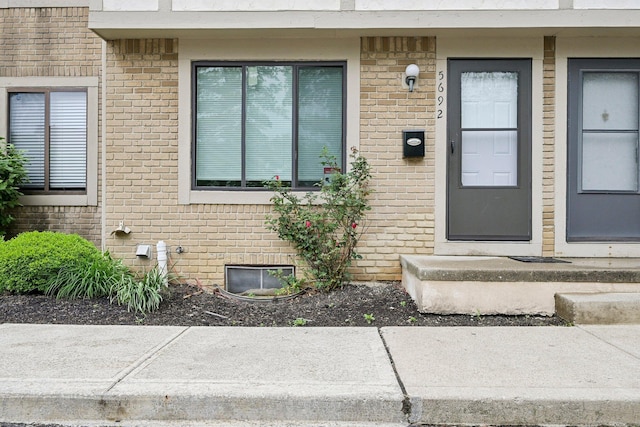 5692 Great Hall Ct, Columbus, OH 43231 - doorway to property with brick siding