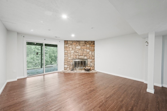5692 Great Hall Ct, Columbus, OH 43231 - unfurnished living room featuring wood finished floors, baseboards, a fireplace, and recessed lighting