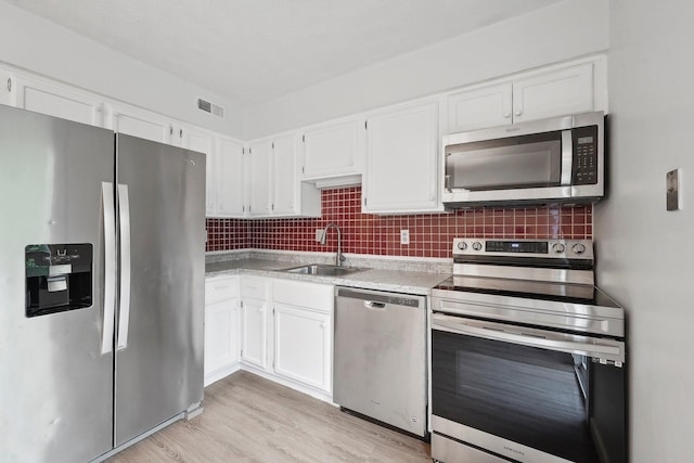 5692 Great Hall Ct, Columbus, OH 43231 - kitchen featuring stainless steel appliances, a sink, and white cabinetry