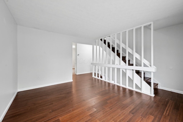 5692 Great Hall Ct, Columbus, OH 43231 - empty room with wood finished floors, baseboards, and stairs