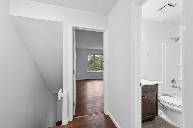5692 Great Hall Ct, Columbus, OH 43231 - bathroom featuring toilet, wood finished floors, vanity, bathing tub / shower combination, and baseboards