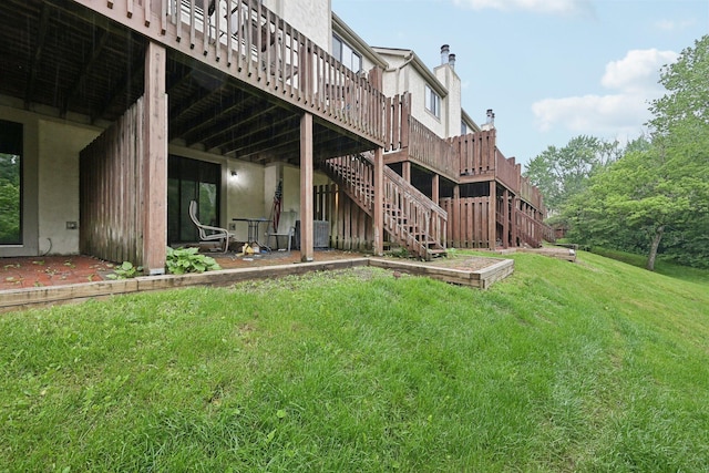 5692 Great Hall Ct, Columbus, OH 43231 - rear view of house featuring a lawn, a wooden deck, and stairway