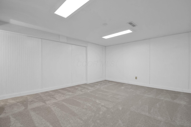 carpeted empty room with visible vents