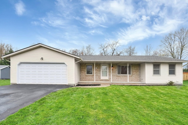 single story home featuring roof with shingles, a front lawn, aphalt driveway, brick siding, and a garage
