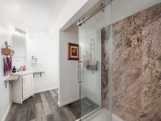 2600 Seneca Dr, London, OH 43140 - full bathroom featuring a shower stall, baseboards, wood finished floors, and vanity