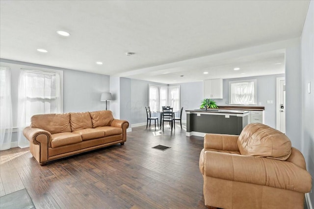 8119 State Route 366, Russells Point, OH 43348 - living area with dark wood-style floors, visible vents, recessed lighting, and baseboards