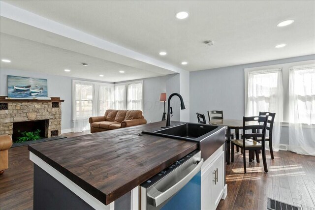 8119 State Route 366, Russells Point, OH 43348 - kitchen with wooden counters, visible vents, stainless steel dishwasher, and open floor plan
