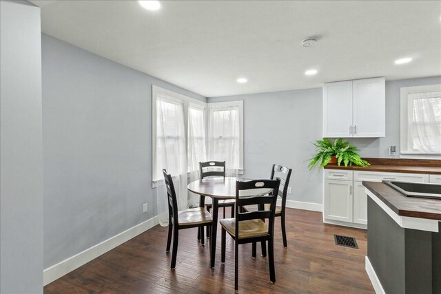 8119 State Route 366, Russells Point, OH 43348 - dining room with baseboards, dark wood-style floors, visible vents, and recessed lighting