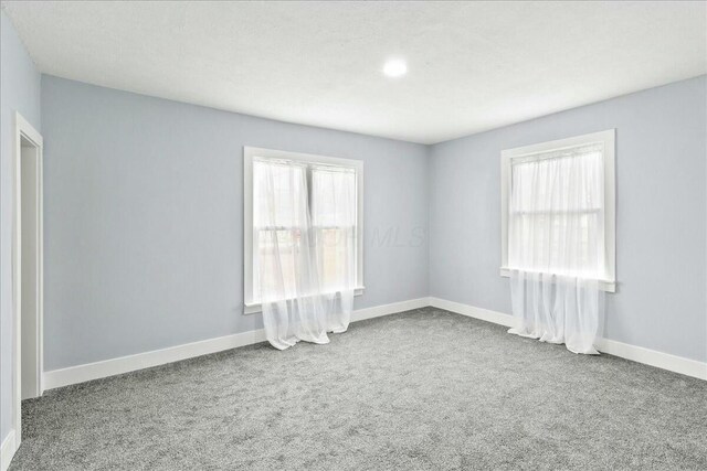 8119 State Route 366, Russells Point, OH 43348 - carpeted spare room featuring baseboards