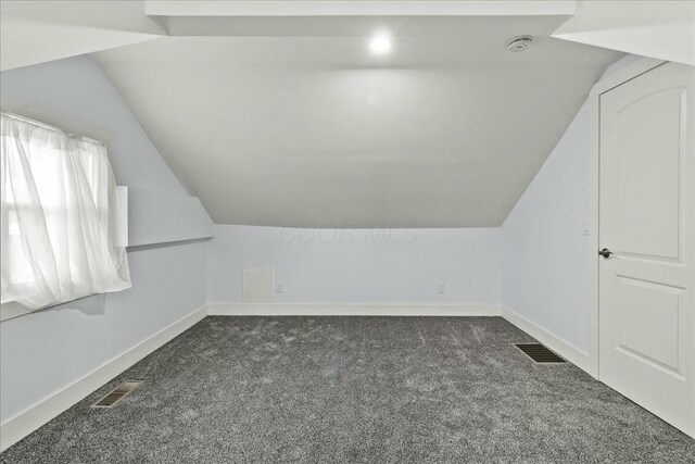 8119 State Route 366, Russells Point, OH 43348 - bonus room with baseboards, visible vents, dark colored carpet, and lofted ceiling