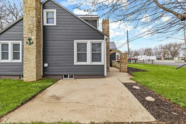 8119 State Route 366, Russells Point, OH 43348 - view of property exterior with a lawn and a chimney