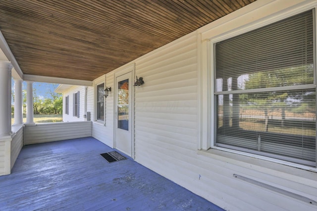 wooden terrace with a porch
