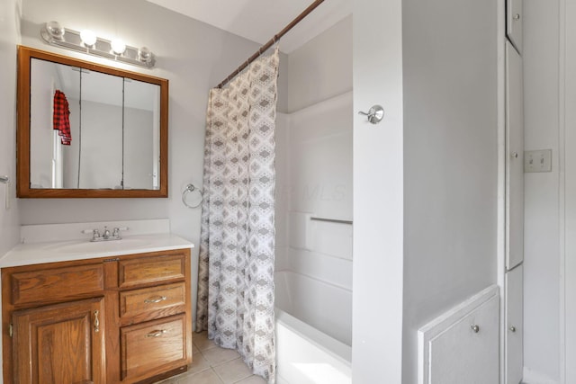 full bath with tile patterned flooring, vanity, and shower / bath combo with shower curtain