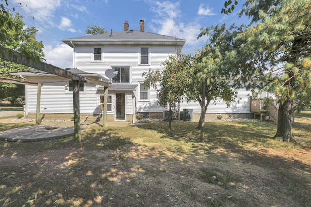 back of property featuring a chimney and a pergola