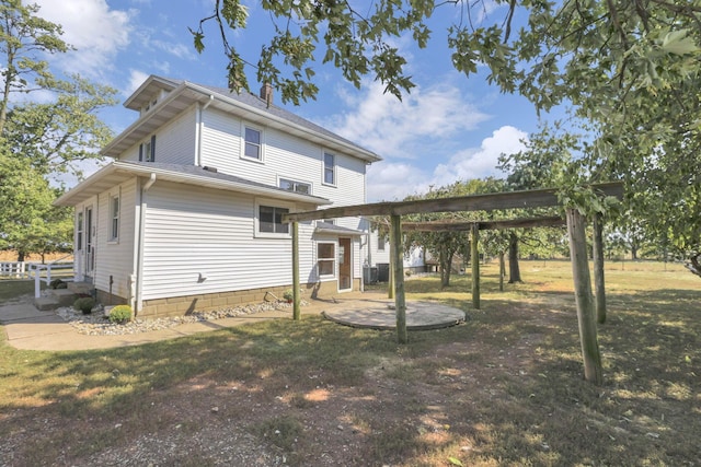 rear view of house with a patio