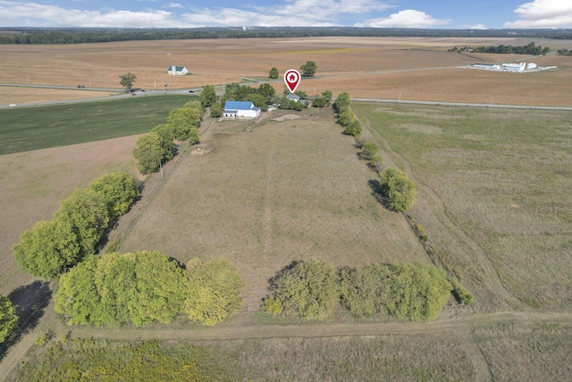 birds eye view of property with a rural view