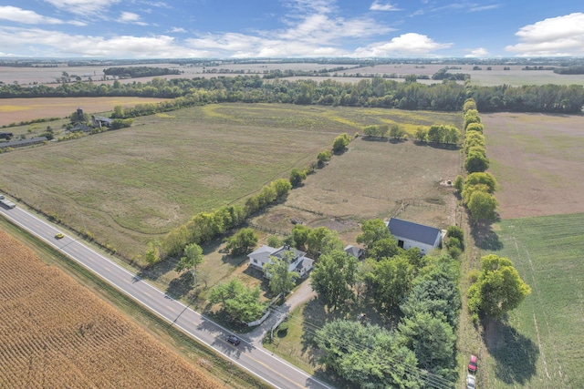 birds eye view of property with a rural view