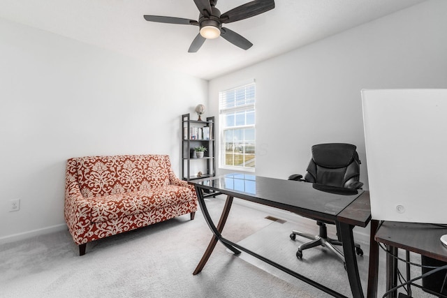 office area featuring baseboards, ceiling fan, and carpet flooring