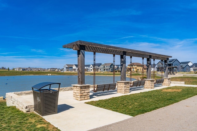 view of home's community featuring a water view and a residential view
