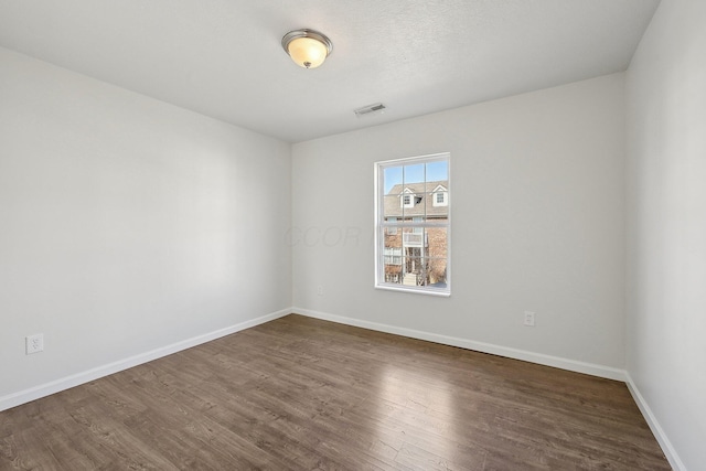 1143 Green Knoll Dr, Westerville, OH 43081 - unfurnished room with dark wood-style floors, baseboards, and visible vents