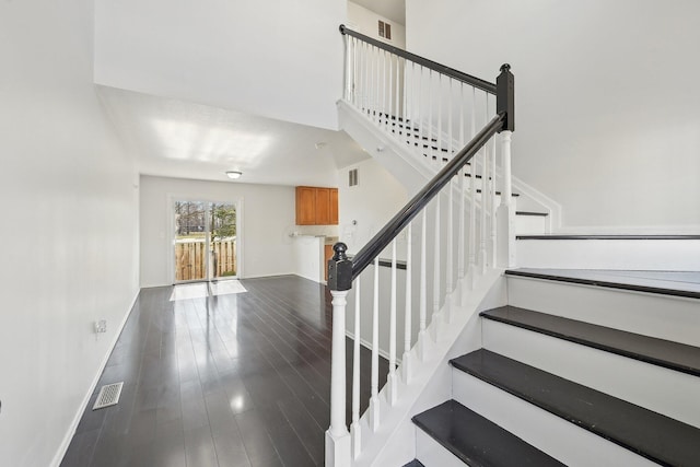 1143 Green Knoll Dr, Westerville, OH 43081 - staircase with baseboards, visible vents, and wood finished floors