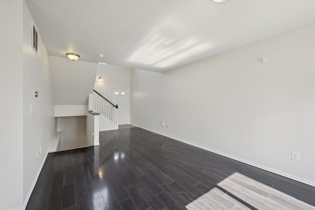 1143 Green Knoll Dr, Westerville, OH 43081 - unfurnished living room featuring visible vents, baseboards, stairs, and wood finished floors