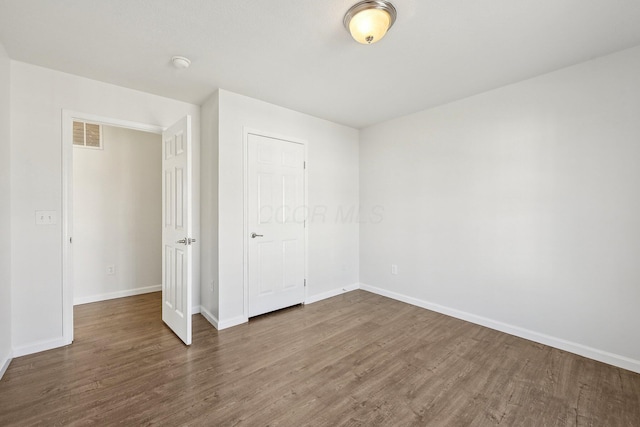 1143 Green Knoll Dr, Westerville, OH 43081 - unfurnished bedroom with baseboards, visible vents, and wood finished floors